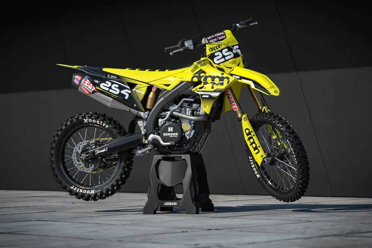 A rider’s yellow and black LIT graphics kit on a Husqvarna