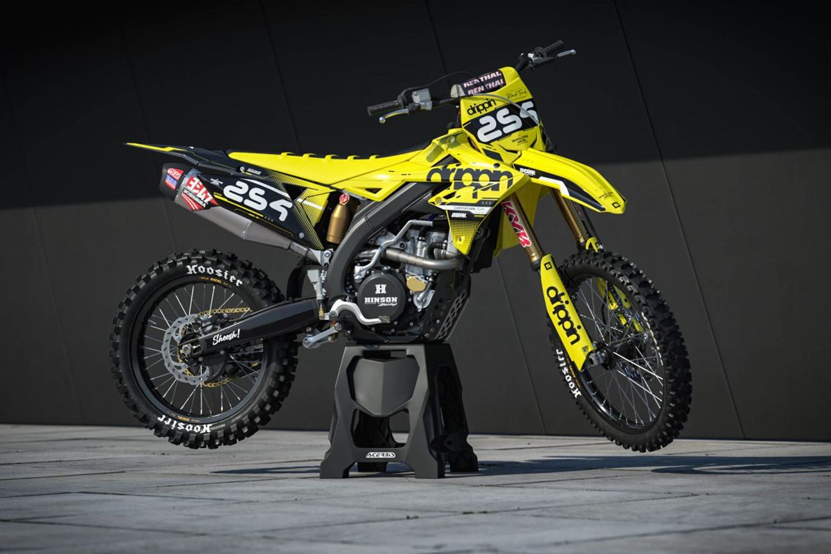 A rider’s yellow and black LIT graphics kit on a Husqvarna